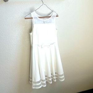 Beautiful Girls white dress, lined chest, sleeveless, knee length.